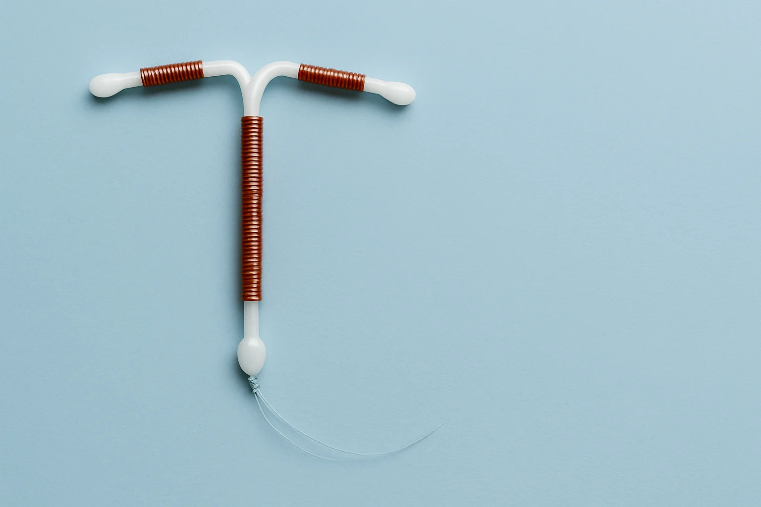 Close-up of a copper IUD device, symbolizing the product injury cases Clay Travis Law takes on when contraceptives cause damage.