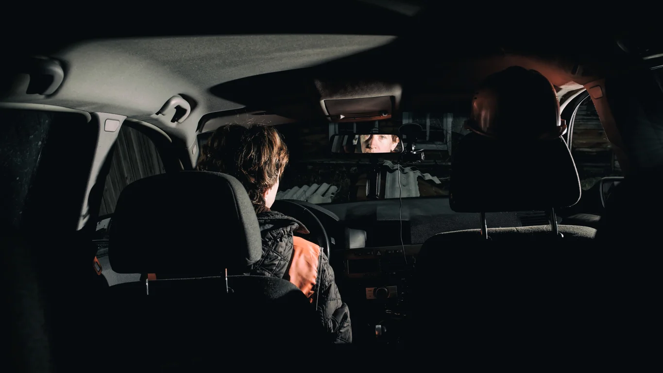 Ride-hail vehicle parked under dim lighting, representing survivors Clay Travis Law defends in rideshare sexual abuse cases.